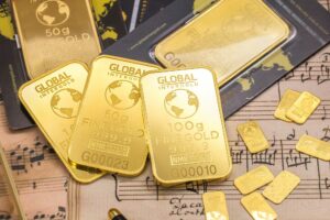 Kepingan emas atau emas batang dengan berat emas 1 gram dan emas 100 gram